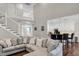Spacious living room features a staircase to the second floor and opens to a well-lit kitchen area at 2720 Oak Manor Dr, Mount Pleasant, SC 29466