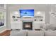 Spacious living room features a fireplace with built-in shelving and a comfortable sofa at 2720 Oak Manor Dr, Mount Pleasant, SC 29466