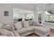 Living room with hardwood floors, large sectional sofa, and a view into the kitchen and dining area at 2720 Oak Manor Dr, Mount Pleasant, SC 29466
