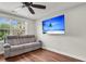 Cozy living room features a gray sofa and a flat-screen TV, perfect for relaxation at 2720 Oak Manor Dr, Mount Pleasant, SC 29466