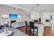 Open-concept living area featuring a fireplace, staircase, and kitchen island with bar seating at 2720 Oak Manor Dr, Mount Pleasant, SC 29466