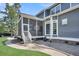 Screened porch featuring outdoor furniture and a ceiling fan at 2720 Oak Manor Dr, Mount Pleasant, SC 29466