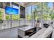 Comfortable screened porch with seating, a coffee table, and a TV at 2720 Oak Manor Dr, Mount Pleasant, SC 29466