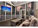 Relaxing screened-in porch with comfortable seating and TV, offering a perfect outdoor retreat at 2720 Oak Manor Dr, Mount Pleasant, SC 29466