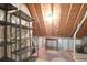 Spacious attic area with a metal storage shelf, a table, and a patterned rug, perfect for storage at 2791 Gaston Gate, Mount Pleasant, SC 29466