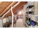 Attic with plastic storage bins, utility pipes and a chair at 2791 Gaston Gate, Mount Pleasant, SC 29466