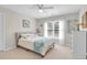 Bright bedroom with carpet, ceiling fan, a bed with white and blue bedding and a window at 2791 Gaston Gate, Mount Pleasant, SC 29466
