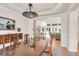 Open dining room with hardwood floors, view to living room, and stylish chandelier at 2791 Gaston Gate, Mount Pleasant, SC 29466