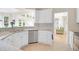 Bright kitchen with white cabinets, stainless steel appliances, granite countertops and a view to the exterior at 2791 Gaston Gate, Mount Pleasant, SC 29466