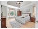 Bright main bedroom with hardwood floors, tray ceiling, and many windows at 2791 Gaston Gate, Mount Pleasant, SC 29466