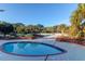 Inviting splash pool surrounded by a spacious deck with brick planters and lush landscaping at 2791 Gaston Gate, Mount Pleasant, SC 29466