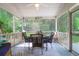 Inviting screened-in porch with comfortable seating, perfect for relaxing and enjoying the outdoors at 2791 Gaston Gate, Mount Pleasant, SC 29466