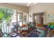 Cozy screened porch furnished with wicker furniture, offering a relaxing outdoor living space at 2791 Gaston Gate, Mount Pleasant, SC 29466