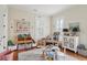 Bright bedroom featuring hardwood floors, playful decor, and ample natural light at 28 Robert Mills Cir, Mount Pleasant, SC 29464