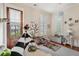 Bright bedroom featuring wood floors, shuttered windows, fun decor, and comfortable play areas at 28 Robert Mills Cir, Mount Pleasant, SC 29464
