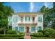 Charming two-story home with a landscaped front yard and inviting double porches, perfect for relaxing outdoors at 28 Robert Mills Cir, Mount Pleasant, SC 29464