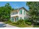Two-story home featuring a double porch, green shutters, and a manicured lawn at 28 Robert Mills Cir, Mount Pleasant, SC 29464
