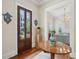 Welcoming foyer featuring hardwood floors, decorative accents, and a glimpse into the stylishly furnished living space at 28 Robert Mills Cir, Mount Pleasant, SC 29464