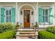 Elegant front entrance with brick steps, manicured greenery, and a beautiful wood door, offering a warm welcome at 28 Robert Mills Cir, Mount Pleasant, SC 29464