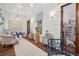 Inviting hallway with hardwood floors, white-painted walls, decor, and a comfortable chair at 28 Robert Mills Cir, Mount Pleasant, SC 29464