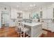 Stylish kitchen with island seating, white cabinets, and modern lighting, perfect for cooking and entertaining at 28 Robert Mills Cir, Mount Pleasant, SC 29464