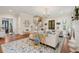 Cozy living space featuring hardwood floors, stylish sofas, fireplace and view into the dining space for modern living at 28 Robert Mills Cir, Mount Pleasant, SC 29464