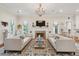 Spacious living room with fireplace, two sofas, decorative accents and detailed ceiling, creating a warm atmosphere at 28 Robert Mills Cir, Mount Pleasant, SC 29464