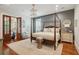 Main bedroom features a four-poster bed, chandelier, and a tranquil and relaxing ambiance at 28 Robert Mills Cir, Mount Pleasant, SC 29464