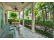 Charming front porch with tiled floor, ceiling fan, and seating, perfect for relaxing at 28 Robert Mills Cir, Mount Pleasant, SC 29464