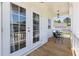 Inviting outdoor balcony with a wooden floor, a white railing, and seating for relaxing outdoors at 2828 Wagner Way, Mount Pleasant, SC 29466