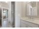 Bathroom with modern vanity, brushed nickel fixtures, and doorway view into an adjacent bedroom at 2828 Wagner Way, Mount Pleasant, SC 29466