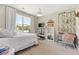 Comfortable bedroom with a plush bed, large window, and a stylish vanity and decor at 2828 Wagner Way, Mount Pleasant, SC 29466