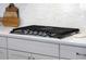 Close up of a gas cooktop set into the counter, with a white tile backsplash at 2828 Wagner Way, Mount Pleasant, SC 29466