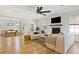 Bright living room with a fireplace, hardwood floors, large windows, and an open concept layout at 2828 Wagner Way, Mount Pleasant, SC 29466