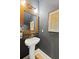 Stylish powder room with a modern vanity, elegant mirror, and unique wall art at 2828 Wagner Way, Mount Pleasant, SC 29466