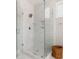 Sleek walk-in shower with glass enclosure, white marble tile, and built-in shelving at 2828 Wagner Way, Mount Pleasant, SC 29466