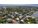 Wide aerial shot showcasing the property's location within a neighborhood filled with mature trees and close to the water at 29 Smith St, Charleston, SC 29401