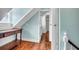 Attic room with wooden console, and a door that leads to the bathroom at 29 Smith St, Charleston, SC 29401
