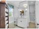 Bright bathroom with custom mirror, fixtures, cabinet and a large window providing natural light at 29 Smith St, Charleston, SC 29401