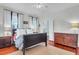 Spacious bedroom features hardwood floors, a ceiling fan, and neutral carpet at 29 Smith St, Charleston, SC 29401