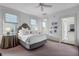 Bright bedroom with carpet, ceiling fan, and a connected bathroom at 29 Smith St, Charleston, SC 29401