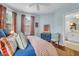 Bright bedroom with hardwood floors, comfortable bed, and ensuite bathroom at 29 Smith St, Charleston, SC 29401