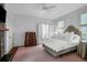 Bedroom features a comfortable bed, wooden floor and ample natural light at 29 Smith St, Charleston, SC 29401