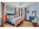 Bedroom features a ceiling fan, wooden floors, and carpet under the bed at 29 Smith St, Charleston, SC 29401
