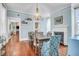 Charming dining room with hardwood floors, fireplace, and stylish light fixture at 29 Smith St, Charleston, SC 29401