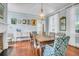 Lovely dining room with decorative fireplace, a chandelier, and blue accent walls at 29 Smith St, Charleston, SC 29401