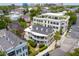 Classic home with a large wraparound porch with views, complemented by lush landscaping and neighborhood scenery at 29 Smith St, Charleston, SC 29401