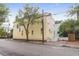 Street view of a yellow two story home with a fenced yard and brick sidewalk at 29 Smith St, Charleston, SC 29401