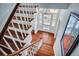 Bright foyer with a grand staircase and hardwood flooring leading to front door at 29 Smith St, Charleston, SC 29401