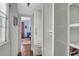 Hallway with storage that leads to a bedroom with hardwood floors at 29 Smith St, Charleston, SC 29401